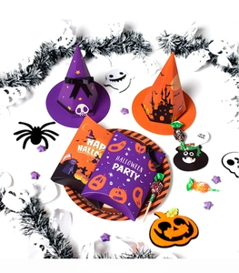 Detail of Halloween party gift boxes with purple and orange witch hats and pumpkin stickers