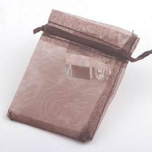 Detailed view of a brown chiffon drawstring jewelry pouch with delicate sheer texture