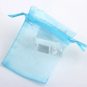 Close-up of light blue organza jewelry pouch with dual drawstring closure design