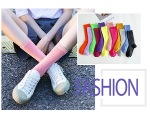 Detail of ribbed cotton mid-calf socks in ten vibrant colors for women