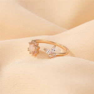 Adjustable gold flower and butterfly ring set featuring pink opal and zircon accents