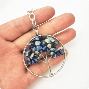 Silver tree of life keychain featuring blue and white crystal stones for wealth
