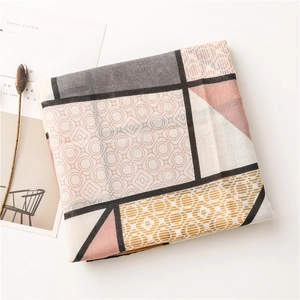 Detail of color-block geometric pattern scarf with textured cotton-linen fabric and edge stitching