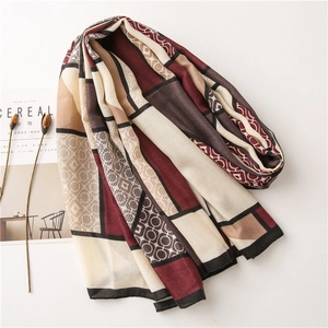 Elegant geometric print scarf in burgundy and brown with retro chain and grid pattern