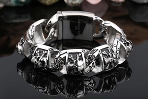 Macro shot of stainless steel skull link bracelet for men with vintage silver finish