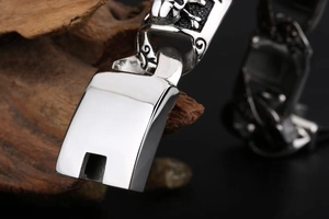 Close-up of punk style men's titanium steel skull bracelet showing intricate relief detail
