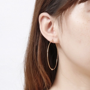 Minimalist large golden hoop earrings for women made of polished stainless steel