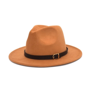 Detail of camel wool fedora hat featuring a black leather band and gold buckle