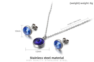 Macro detail of stainless steel jewelry set with deep blue crystal necklace and earrings