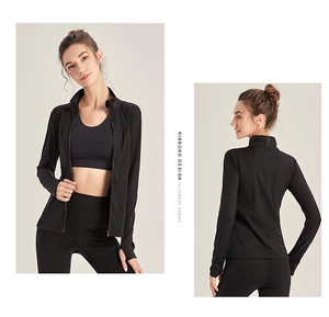 Detail of a black zip-up sports jacket with ribbed design and thumbhole cuffs