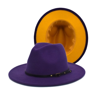 Detail of wool fedora hat showing purple exterior and yellow lining contrast with belt