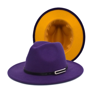 Detail of fedora hat with purple exterior, yellow brim lining and leather strap