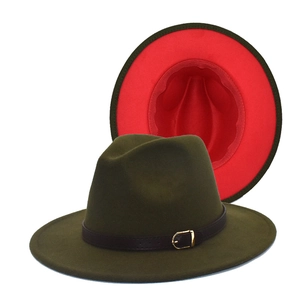 Detail of wool fedora hat with olive green exterior and contrasting red inner brim detail