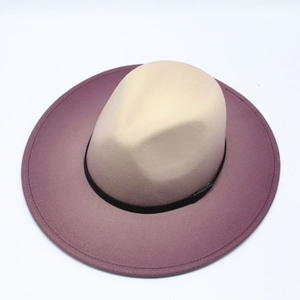 Detail of classic wool fedora hat featuring a beige to purple gradient finish and black band