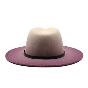 Detail of wool felt fedora featuring light beige to purple gradient and black band
