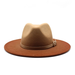 Detail of camel and rust two-tone wide brim wool felt jazz hat with gold buckle belt