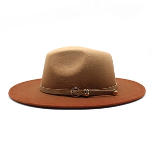 Detail of the two-tone fedora hat with thin leather band and gold heart buckle