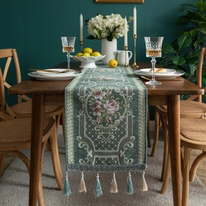 Modern green chenille table runner with floral jacquard patterns and elegant tassels