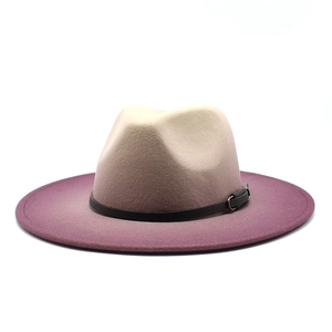 Detail of gradient fedora hat featuring a beige to purple transition and leather band