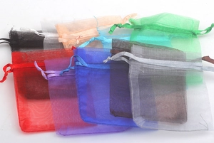 Detailed collection of colorful organza drawstring bags in various vibrant shades