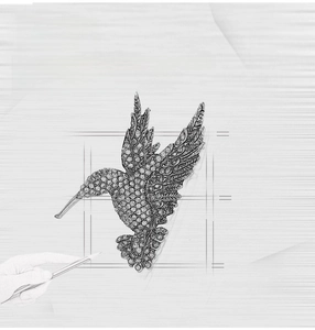 Macro design sketch of a silver hummingbird brooch with sparkling crystal rhinestones