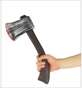 Detail of a hand holding a realistic toy axe with a rustic wood-style handle and red blade