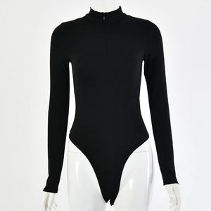 Detailed view of the slim-fit black long-sleeved bodysuit featuring a hidden front zipper