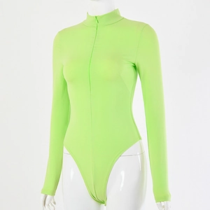 Detail of neon green long sleeve bodysuit featuring a front zipper on white background