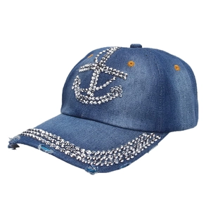 Blue denim baseball cap featuring a rhinestone anchor pattern and studded brim detail