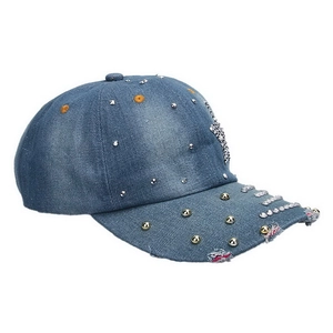 Close-up of distressed denim baseball cap with sparkling rhinestones and metal rivets
