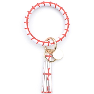 Detail of white PU leather keychain bracelet featuring red baseball stitching and gold clasp