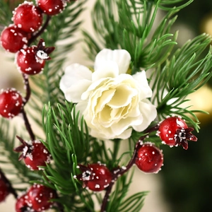 Mini Christmas tree decoration with green pine needles, red berries and white silk flower