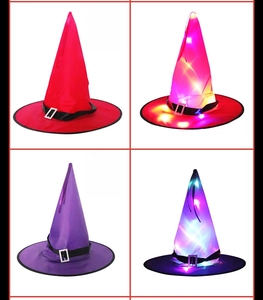 Detail view of red and purple LED witch hats showing unlit and glowing effects
