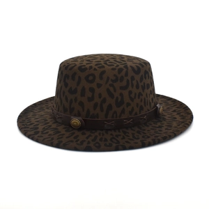 Detail of leopard print fedora hat featuring leather band and sunburst metal rivets
