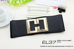 Close-up of black elastic wide belt featuring a polished gold square metal buckle detail