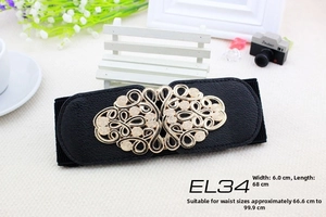 Detail of 6cm wide black elastic belt featuring a golden hollow alloy floral buckle