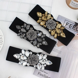 Cinture elastiche con fibbie a rosa di strass nei colori champagne, grigio e bianco