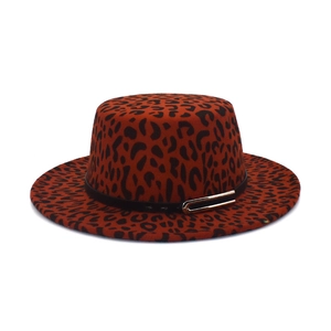 Red-brown leopard print flat top wool fedora hat with black band and gold buckle
