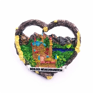 Detailed relief of Neuschwanstein Castle on a heart-shaped resin German souvenir magnet