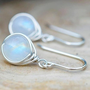 Handmade wire-wrapped moonstone earrings with iridescent stones in a boho silver style