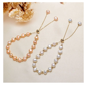 Adjustable freshwater pearl bracelets in pink and white with gold accents on silk