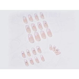 French V-tip press-on nails in nude pink gradient with rhinestones and round shape