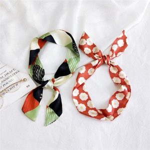 Floral and geometric silk scarf for neck or bag handle decoration in orange and green