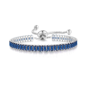 Close-up of adjustable silver bracelet with dark blue rectangular cut crystal stones