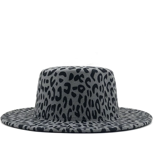 Detail shot of a grey wool fedora featuring a stylish black leopard print and flat brim