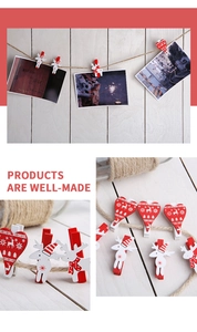 Detail of festive wooden Christmas clips with red hearts and reindeer patterns