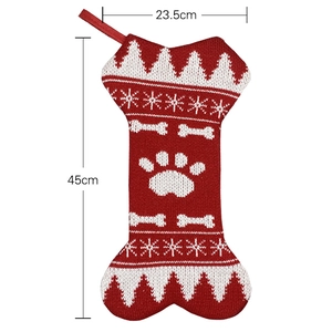 Knitted bone-shaped Christmas stocking with snowflake patterns and size markings