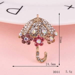 Detailed view of umbrella brooch with dimensions 31x24.5mm and colorful rhinestones