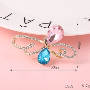 Detail of a butterfly charm with pink and blue pear-cut rhinestones, size 53x30mm