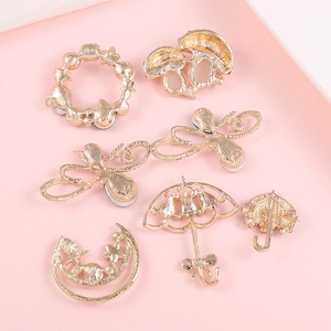 Detailed view of 7-piece gold-plated alloy charms featuring mushroom, moon, and dragonfly shapes